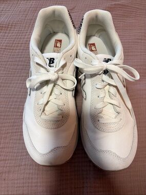New Balance White Canvas Trainers with Silver NB Logo